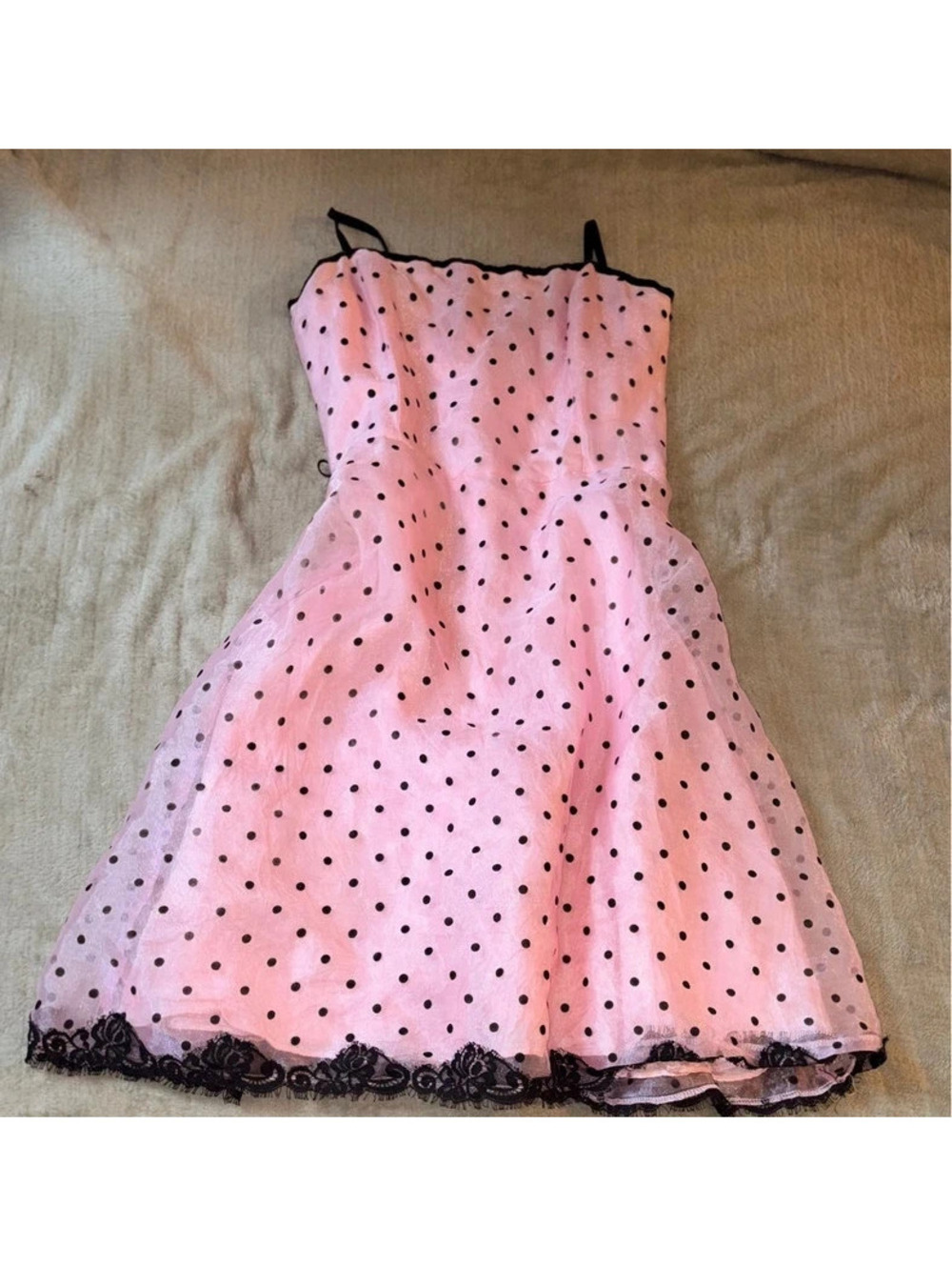 pink 50s style pin up dress with black polkadots and lace